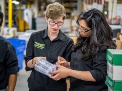 Photo of Sustainability Studies students at printing warehouse.